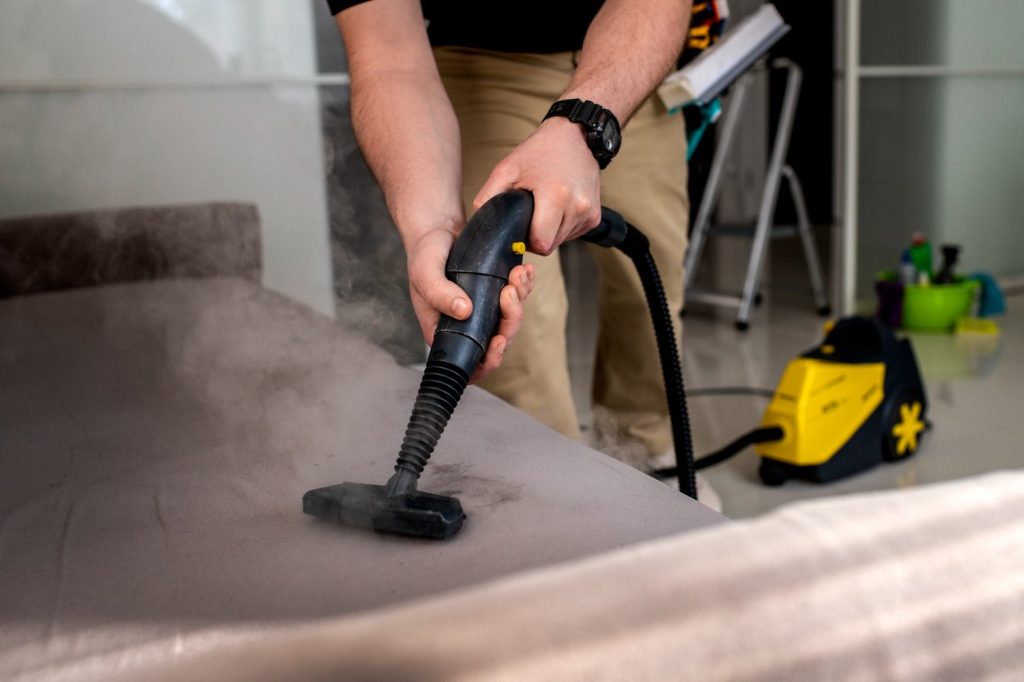 Steam cleaning a mattress using a professional hot water extraction machine